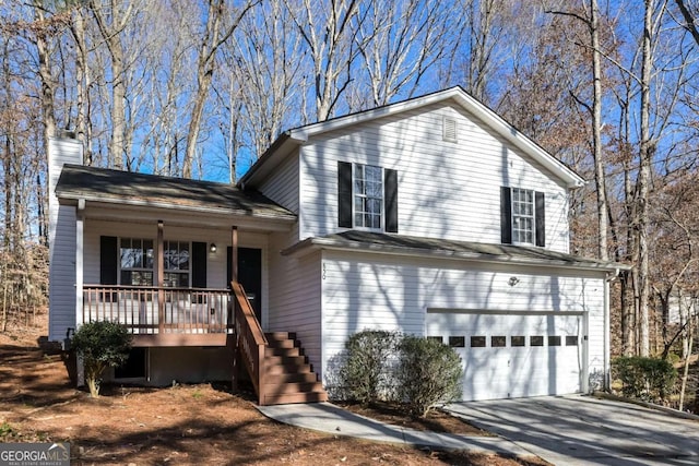 tri-level home with a chimney, covered porch, concrete driveway, a garage, and stairs