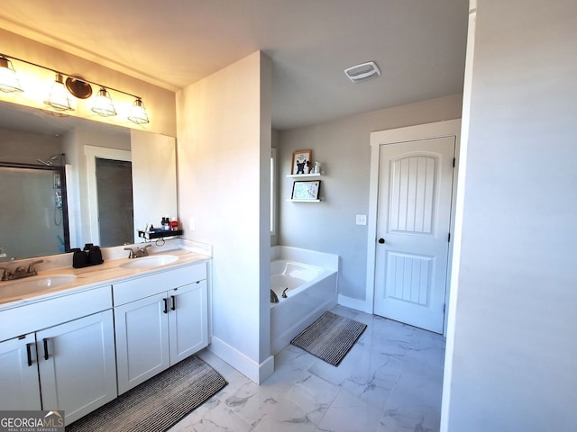 full bath featuring visible vents, marble finish floor, and a sink