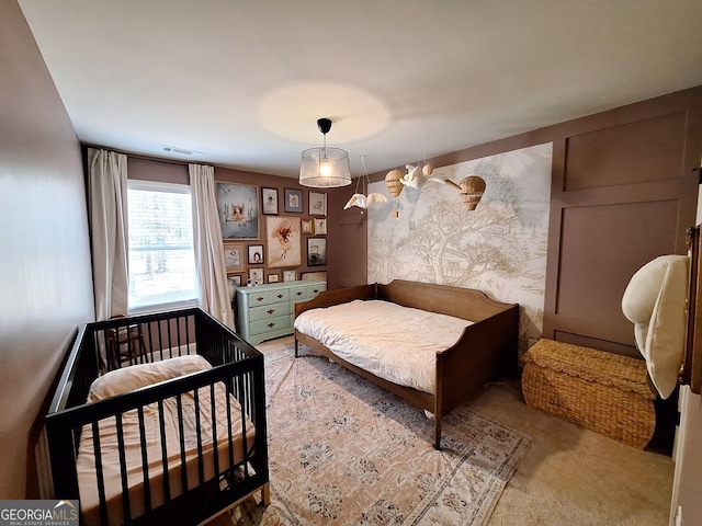 bedroom featuring visible vents and carpet