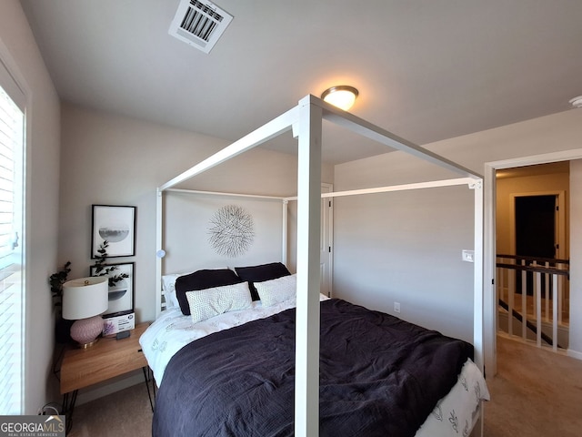 bedroom featuring visible vents