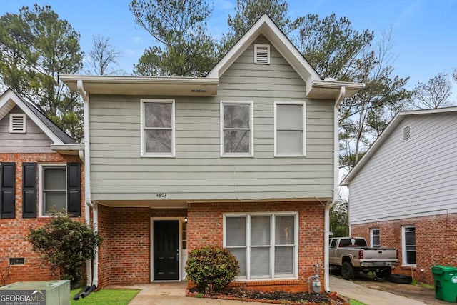 view of front of house with brick siding