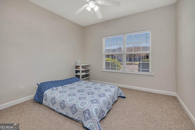 bedroom with baseboards, a ceiling fan, and carpet flooring