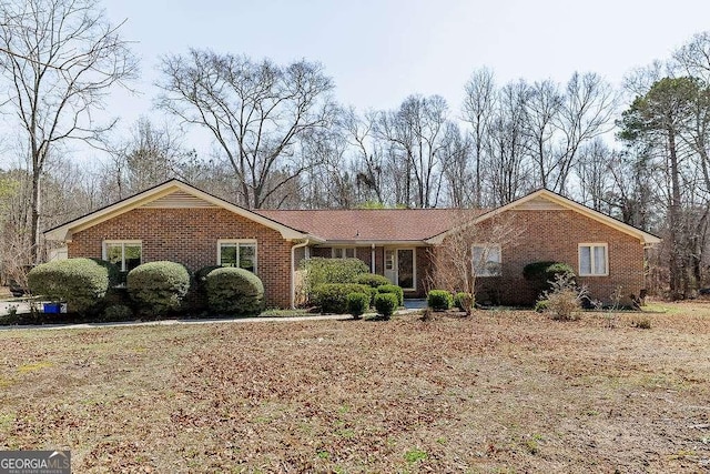 ranch-style house with brick siding