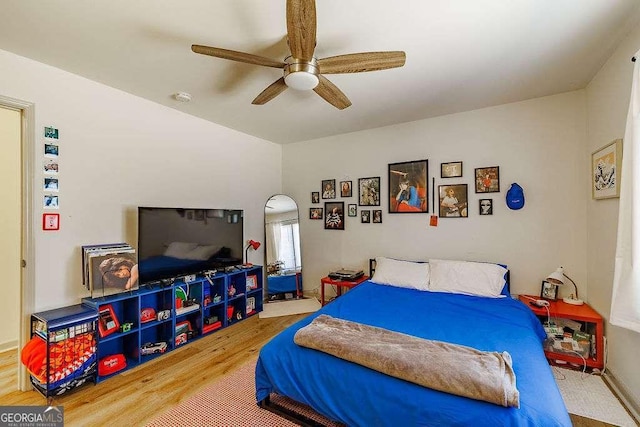 bedroom featuring ceiling fan and wood finished floors