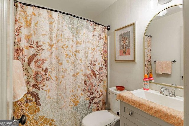 bathroom with vanity and toilet