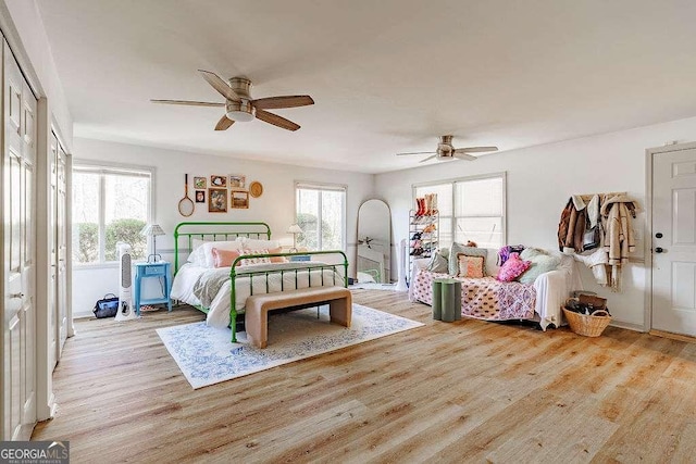 bedroom with a ceiling fan and wood finished floors