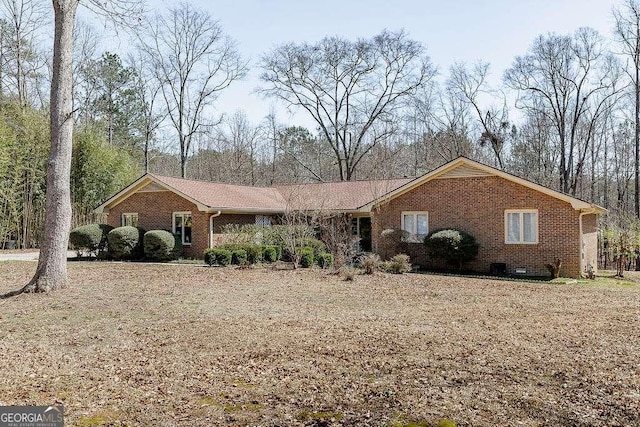 ranch-style home featuring brick siding