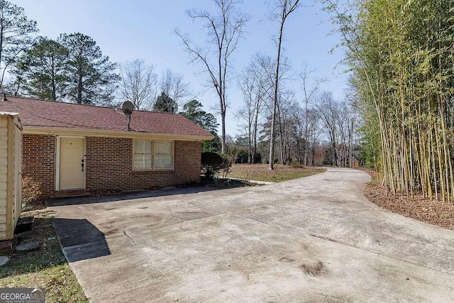 view of home's exterior with brick siding