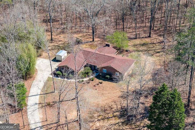 aerial view with a wooded view