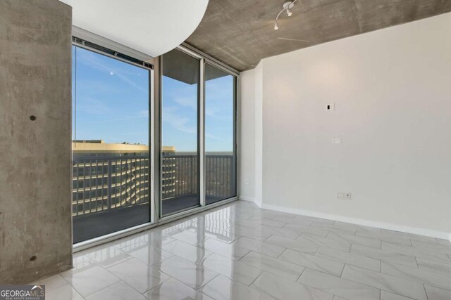 kitchen featuring visible vents, baseboards, appliances with stainless steel finishes, and open floor plan