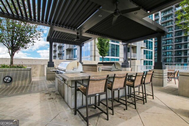 view of patio featuring an outdoor hangout area and a pergola