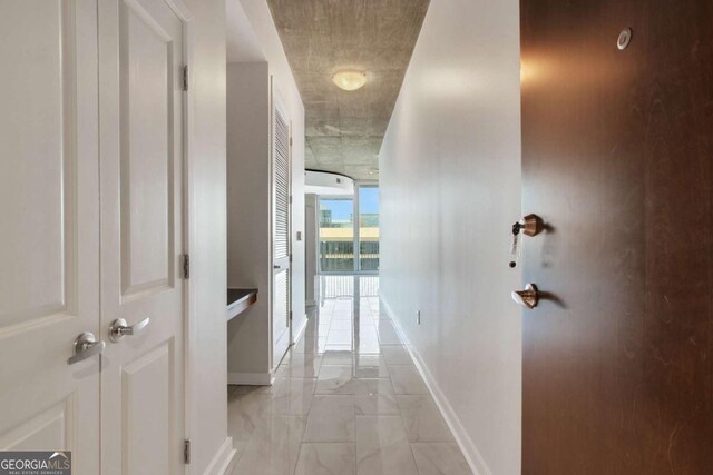 interior space featuring a wall of windows, a view of city, baseboards, and visible vents