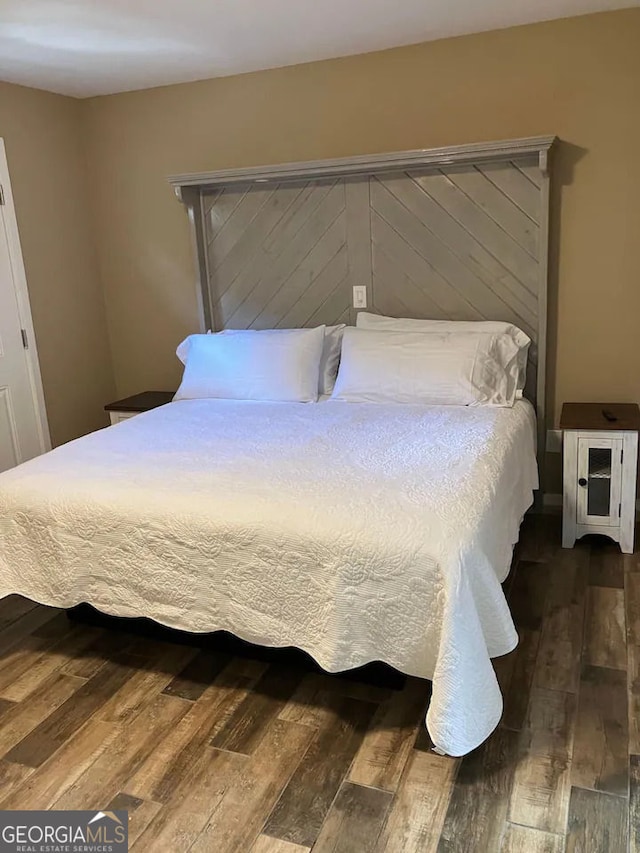 bedroom with wood finished floors