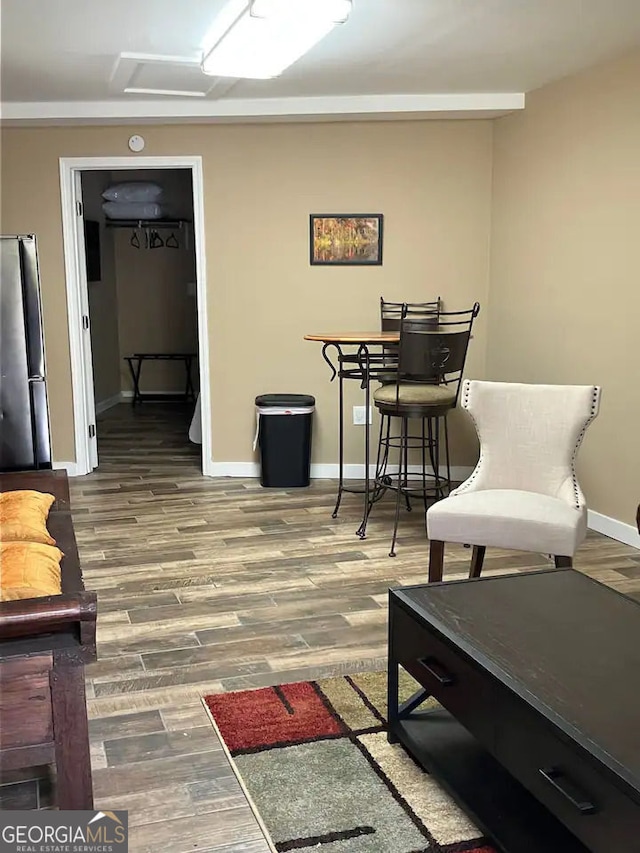 sitting room featuring wood finished floors and baseboards