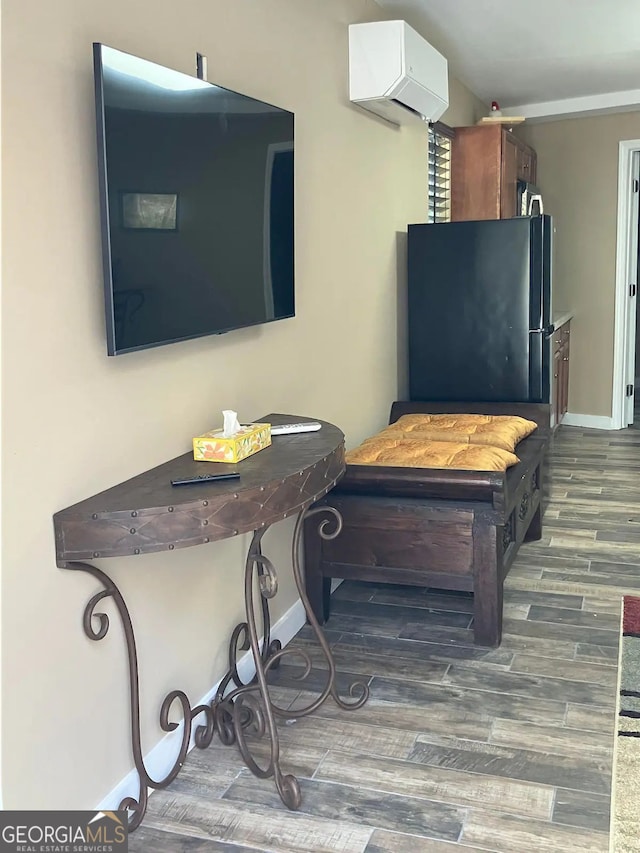 893 Old 441 S, Clayton, GA 30525 - interior details with an AC wall unit, freestanding refrigerator, baseboards, and wood finished floors