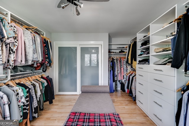 spacious closet with light wood-style floors