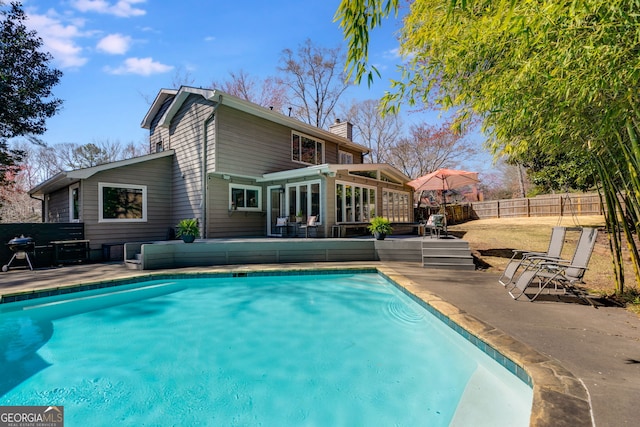 view of pool with a patio area, a fenced in pool, and a fenced backyard