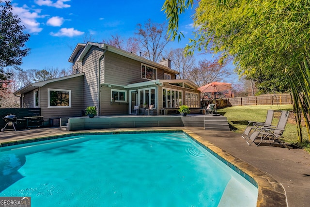 view of pool featuring a fenced in pool, a fenced backyard, and a patio