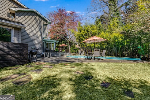 view of yard with a patio and an outdoor pool
