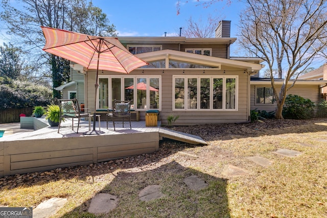 back of property featuring a chimney