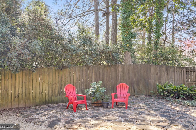 view of patio / terrace featuring fence