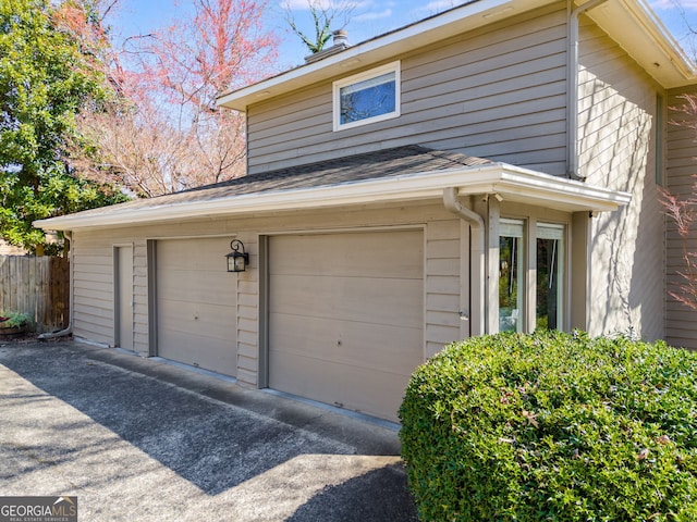 garage with fence