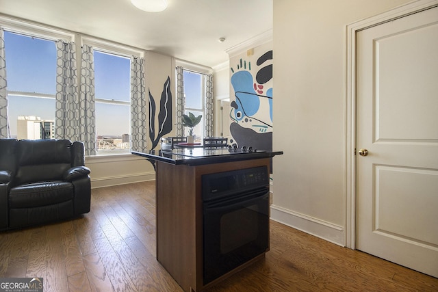 office space with dark wood-style floors and baseboards