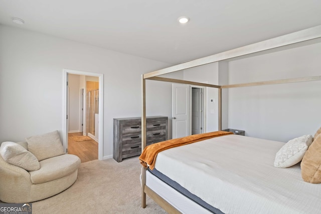 bedroom featuring recessed lighting, a closet, light carpet, and baseboards