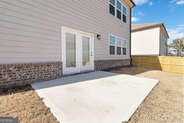 view of patio featuring fence