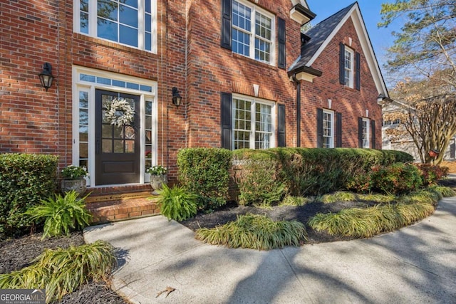 entrance to property with brick siding