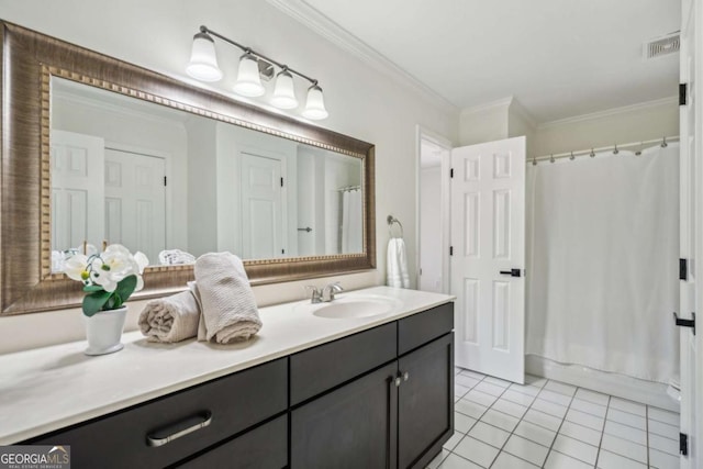 full bathroom with visible vents, vanity, crown molding, and tile patterned flooring