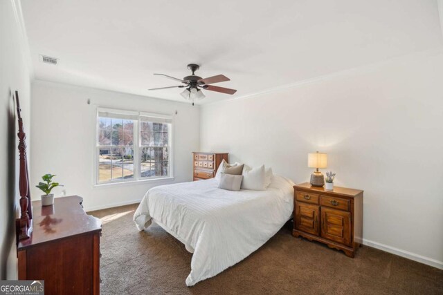 carpeted bedroom featuring visible vents, a ceiling fan, and baseboards