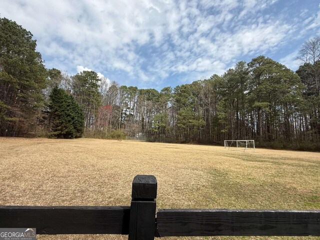 view of yard featuring a wooded view