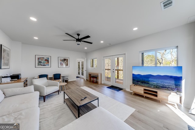 living room featuring visible vents, ceiling fan, recessed lighting, french doors, and wood finished floors