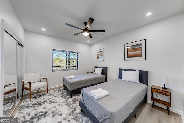 bedroom featuring recessed lighting, light wood-type flooring, and baseboards