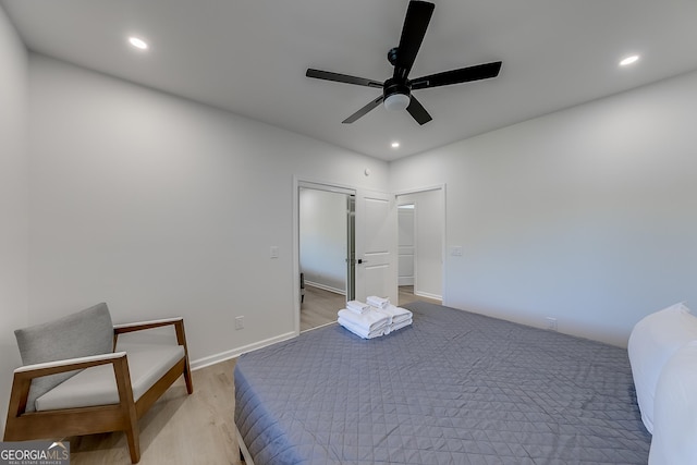 bedroom featuring recessed lighting, baseboards, light wood finished floors, and ceiling fan