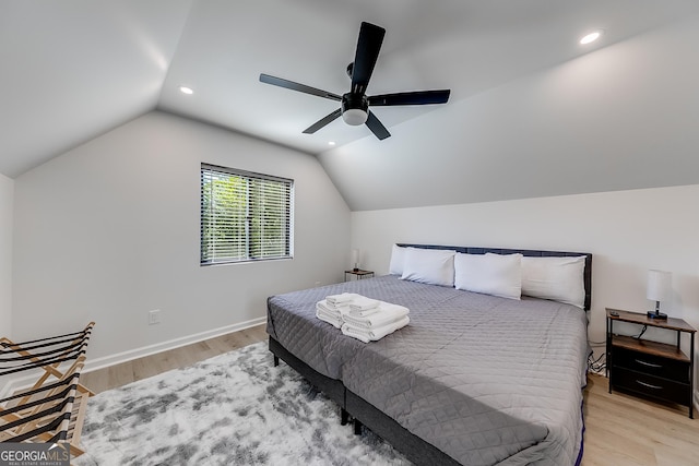 bedroom featuring recessed lighting, lofted ceiling, light wood-style floors, and a ceiling fan