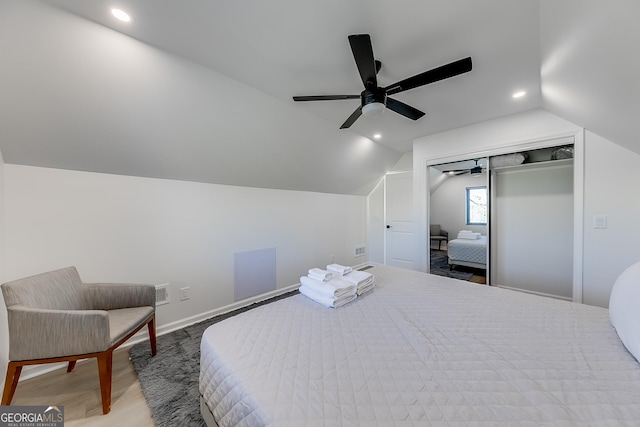 bedroom featuring vaulted ceiling, recessed lighting, wood finished floors, and baseboards