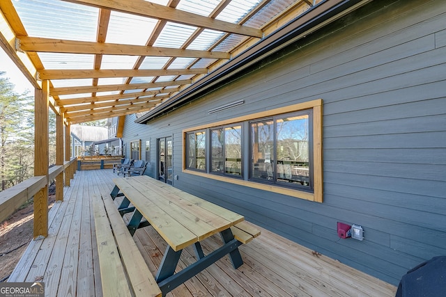 wooden terrace featuring outdoor dining space