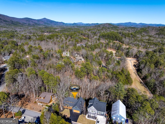 bird's eye view featuring a view of trees and a mountain view