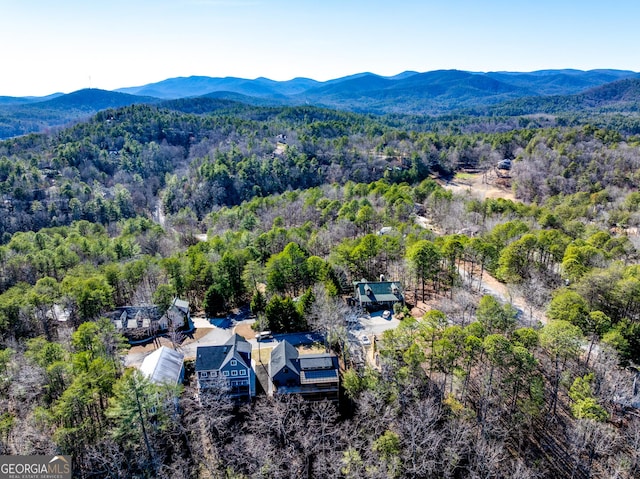 bird's eye view with a mountain view and a wooded view