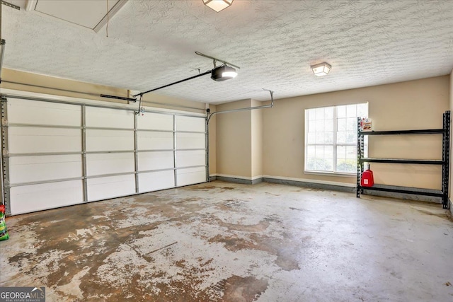 garage featuring a garage door opener and baseboards