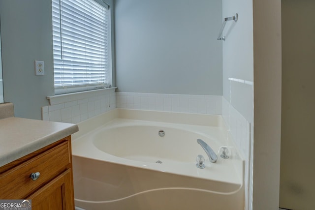 full bathroom with vanity and a garden tub