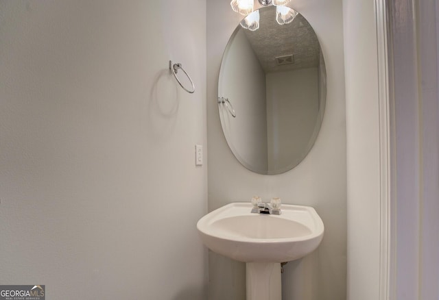 bathroom with a textured ceiling