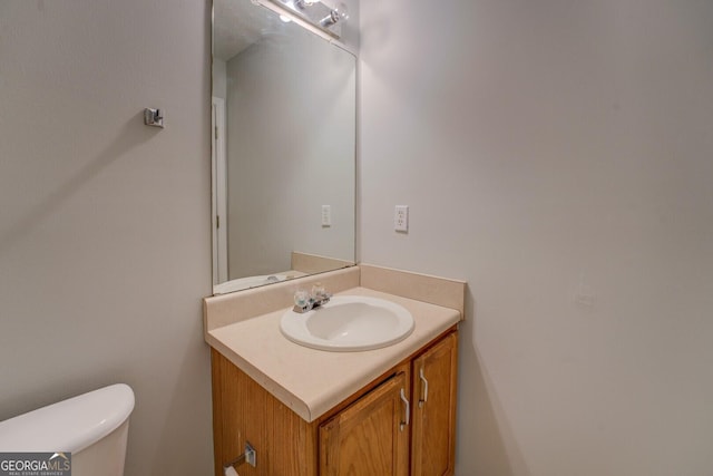 half bath with toilet and vanity