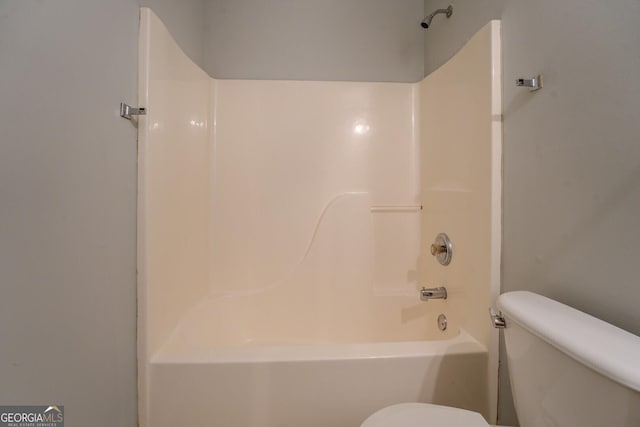 full bathroom featuring bathtub / shower combination and toilet