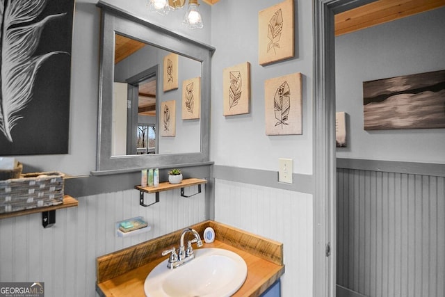 bathroom featuring wainscoting and a sink