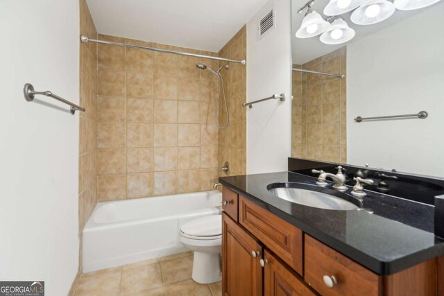 full bath with visible vents, toilet, shower / bathtub combination, tile patterned flooring, and vanity