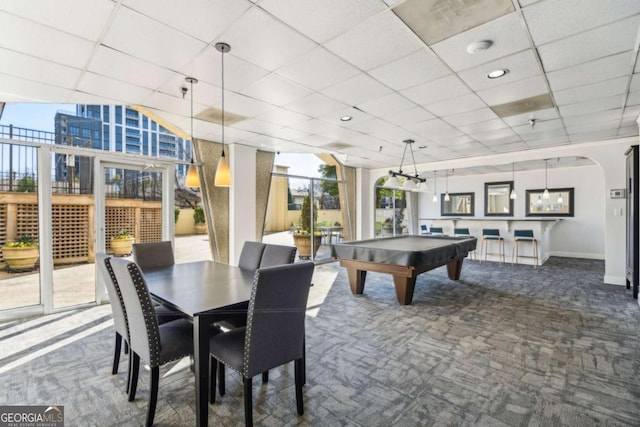 game room featuring pool table, arched walkways, dark colored carpet, and a wealth of natural light