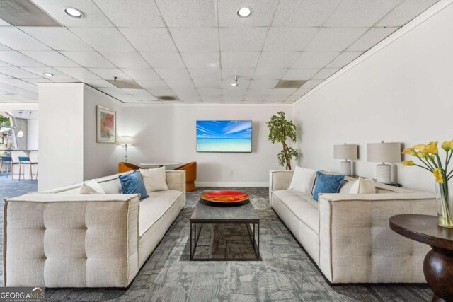 living room with recessed lighting and baseboards